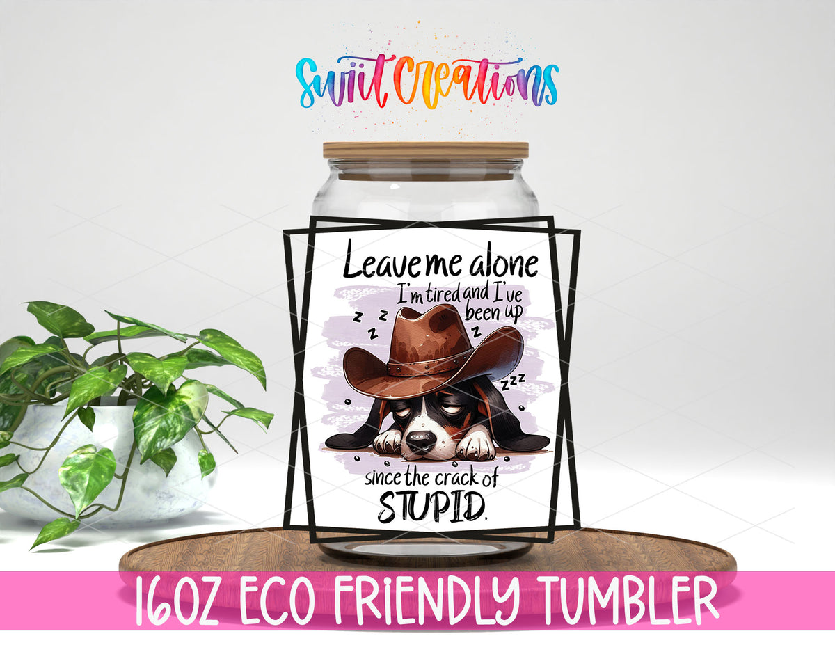 Leave Me Alone Cowboy Dog design on a 16 oz clear glass tumbler with bamboo lid