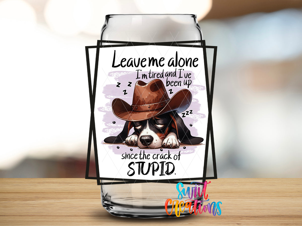 Leave Me Alone Cowboy Dog design close-up on a clear glass can tumbler