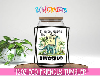 If History Repeats Itself Dinosaur design on a 16 oz clear glass tumbler with bamboo lid