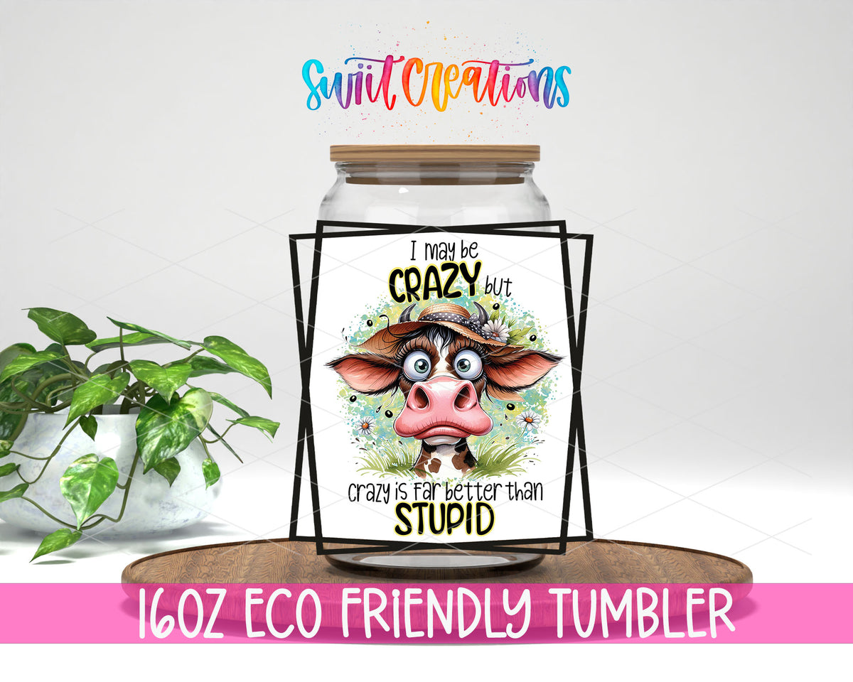 I May Be Crazy Cow design on a 16 oz clear glass tumbler with bamboo lid