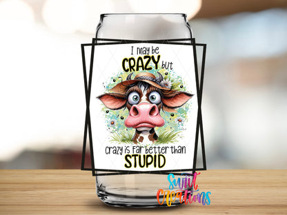I May Be Crazy Cow design close-up on a clear glass can tumbler
