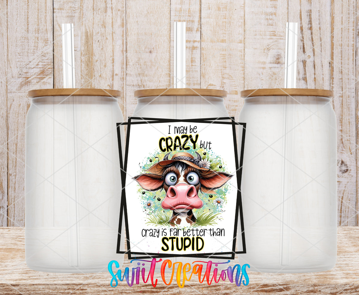 I May Be Crazy Cow frosted glass tumbler mockup with bamboo lids and straws