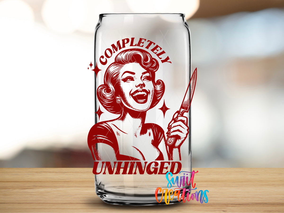 Completely Unhinged design close-up on a clear glass can tumbler