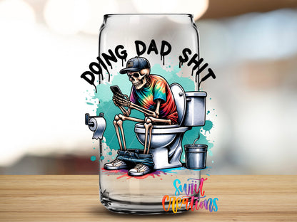 Doing Dad Shit design close-up on a clear glass can tumbler