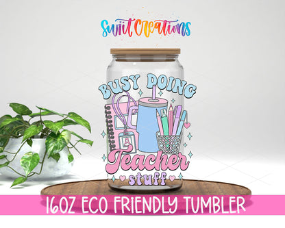 Busy Doing Teacher Stuff design on a 16 oz clear glass tumbler with bamboo lid