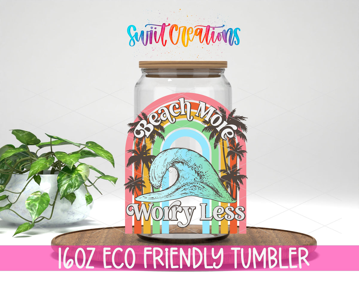 Beach More Worry Less Wave design on a 16 oz clear glass tumbler with bamboo lid