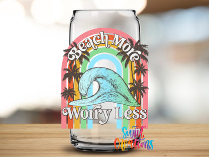 Beach More Worry Less Wave design close-up on a clear glass can tumbler
