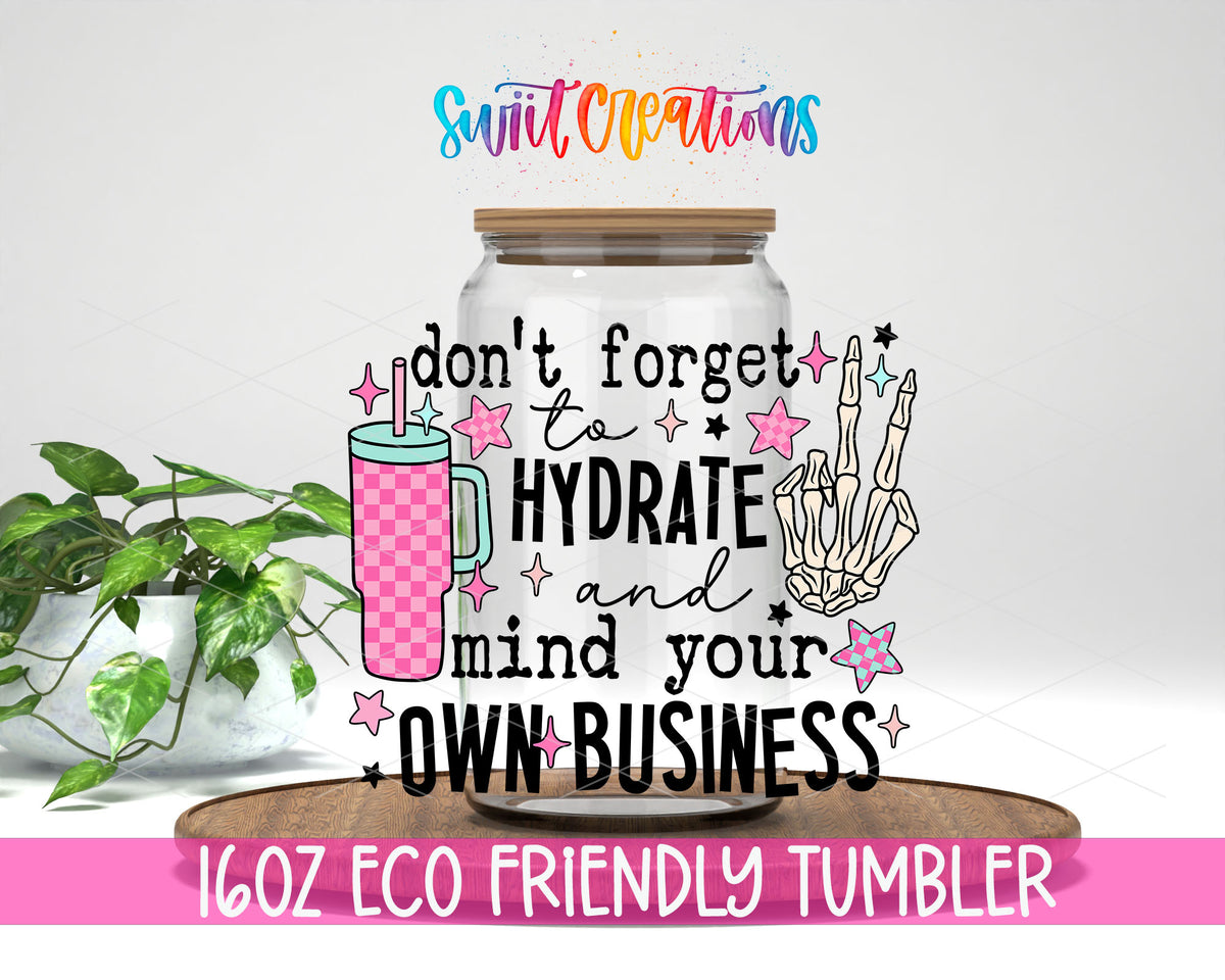 Hydrate and Mind Your Own Business design on a 16 oz clear glass tumbler with bamboo lid