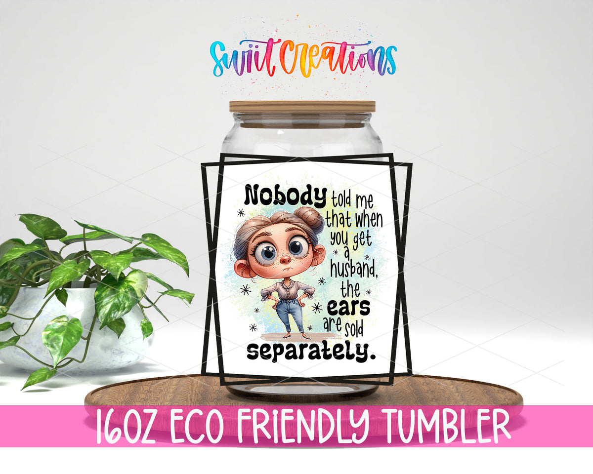 Husband Ears Sold Separately design on a 16 oz clear glass tumbler with bamboo lid