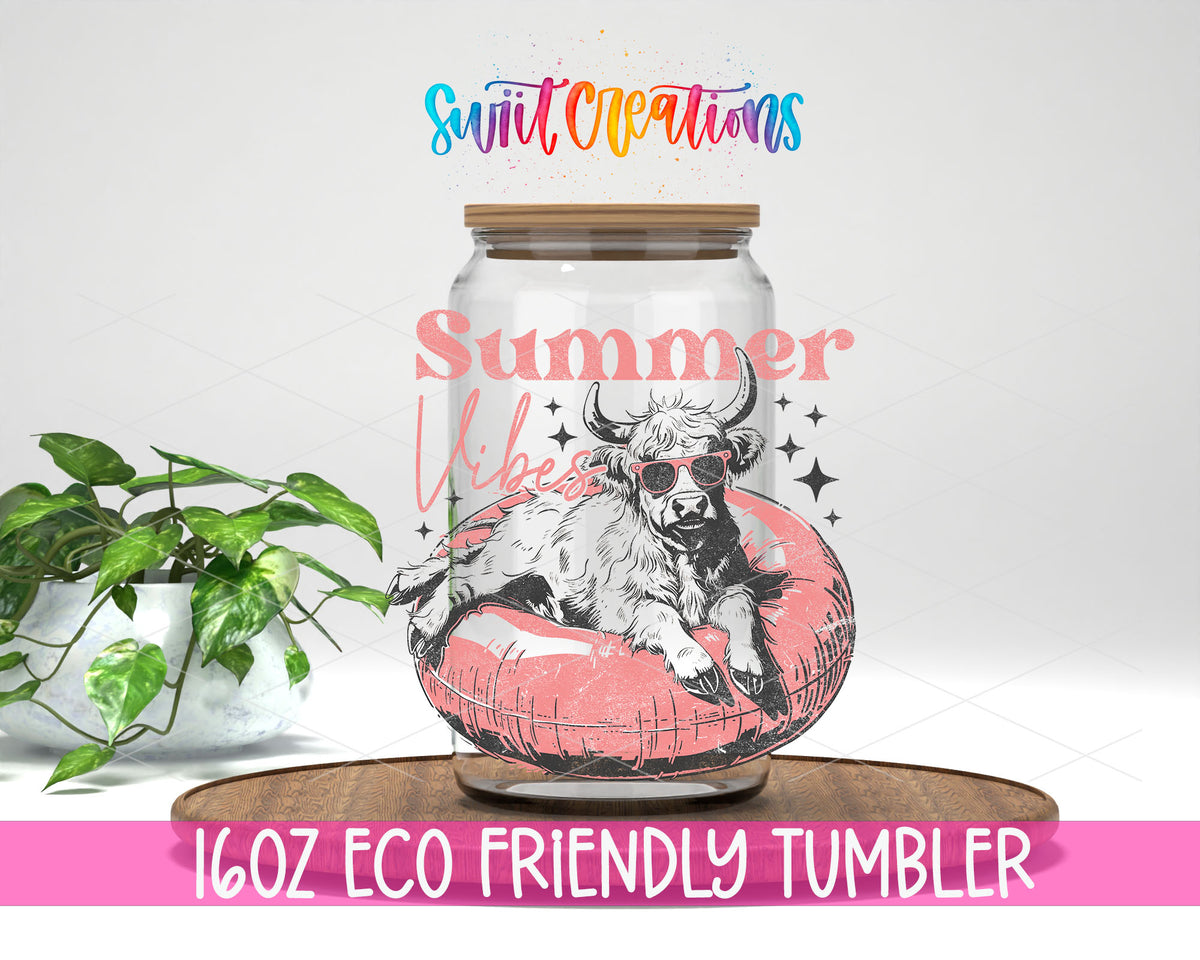 Summer Vibes Cow Pool Float design on a 16 oz clear glass tumbler with bamboo lid
