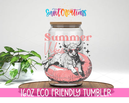 Summer Vibes Cow Pool Float design on a 16 oz clear glass tumbler with bamboo lid