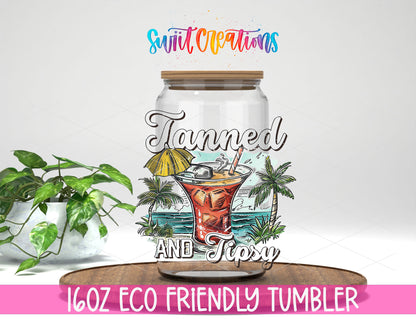 Tanned and Tipsy Cocktail design on a 16 oz clear glass tumbler with bamboo lid