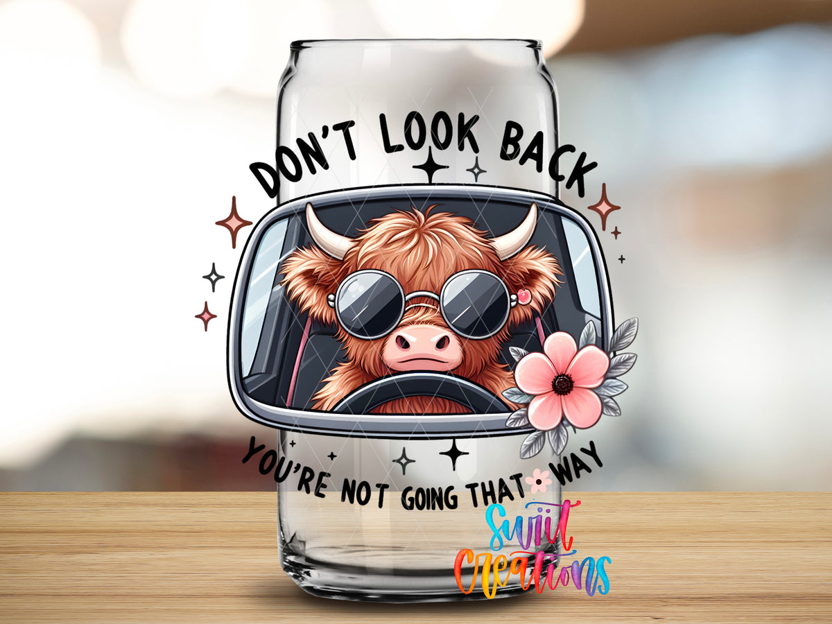 Do Not Look Back Cow design close-up on a clear glass can tumbler