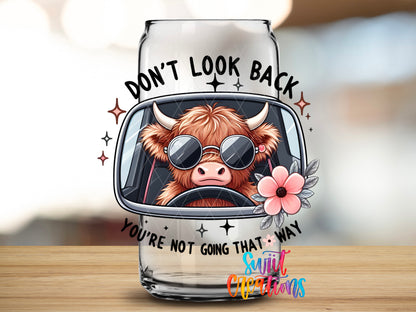 Do Not Look Back Cow design close-up on a clear glass can tumbler