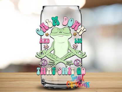 Calm Down and Let That Shit Go design close-up on a clear glass can tumbler