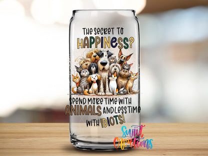 The Secret to Happiness Animals design close-up on a clear glass can tumbler