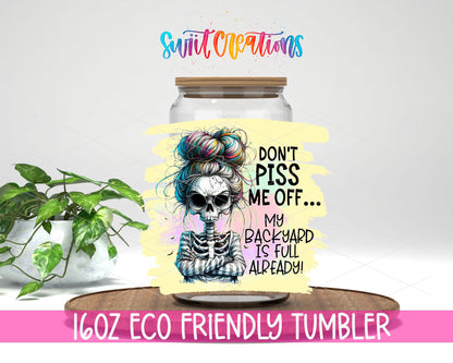 Do Not Piss Me Off Skeleton design on a 16 oz clear glass tumbler with bamboo lid