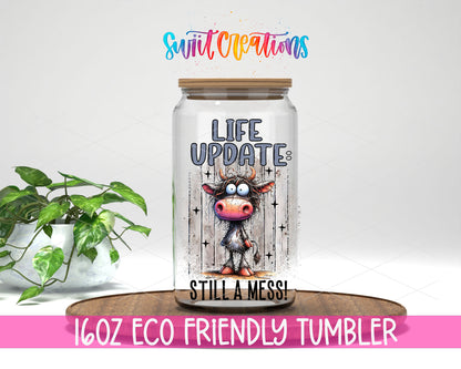 Life Update Still a Mess design on a 16 oz clear glass tumbler with bamboo lid