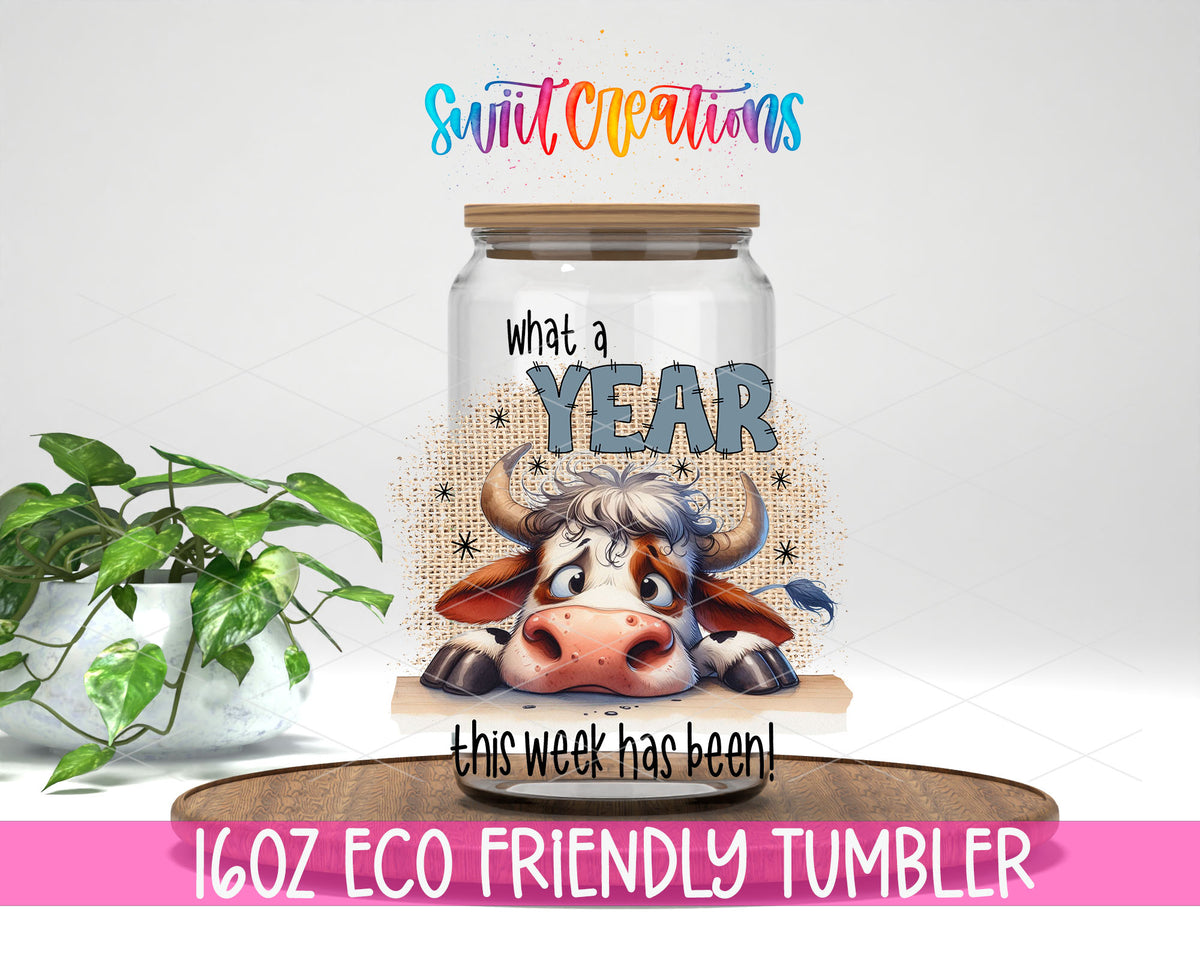 What a Year This Week Has Been design on a 16 oz clear glass tumbler with bamboo lid