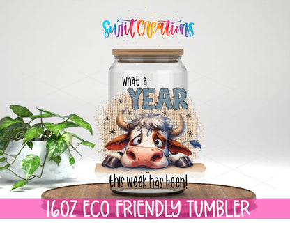 What a Year This Week Has Been design on a 16 oz clear glass tumbler with bamboo lid