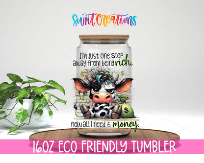 One Step Away From Being Rich design on a 16 oz clear glass tumbler with bamboo lid
