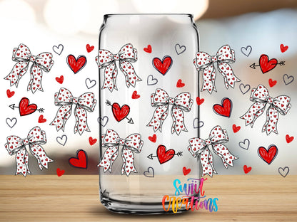 Close-up of the Hearts and Bows UV DTF full wrap on a clear glass can