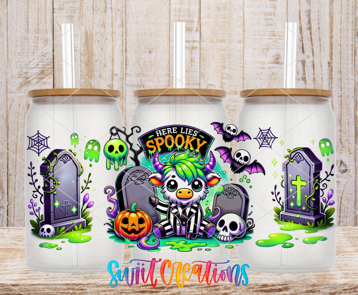 Here Lies Spooky highland cow graveyard UV DTF full wrap on three frosted glass cans with bamboo lids