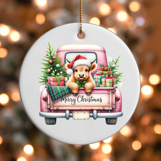 Highland Cow Pink Truck ornament UV DTF transfer on a round white ornament with a bokeh light background