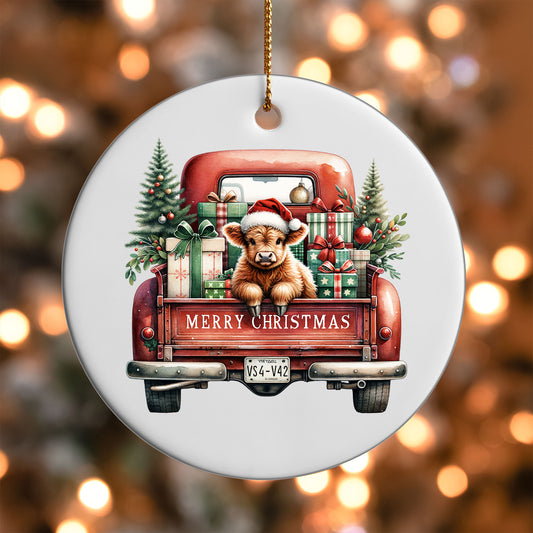 Highland Cow Red Truck ornament UV DTF transfer on a round white ornament with a bokeh light background