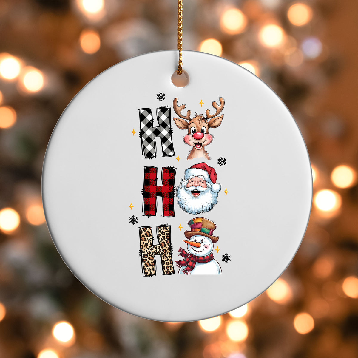 Ho Ho Ho Characters ornament UV DTF transfer on a round white ornament with a bokeh light background
