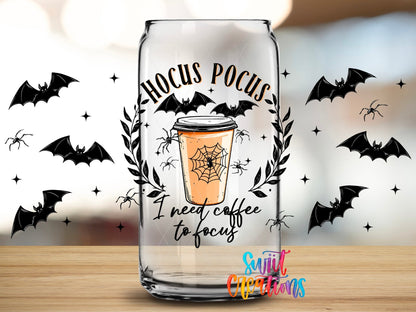 Close-up of the Hocus Pocus I Need Coffee to Focus UV DTF full wrap on a clear glass can