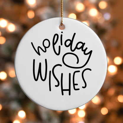Holiday Wishes ornament UV DTF transfer on a round white ornament with a bokeh light background