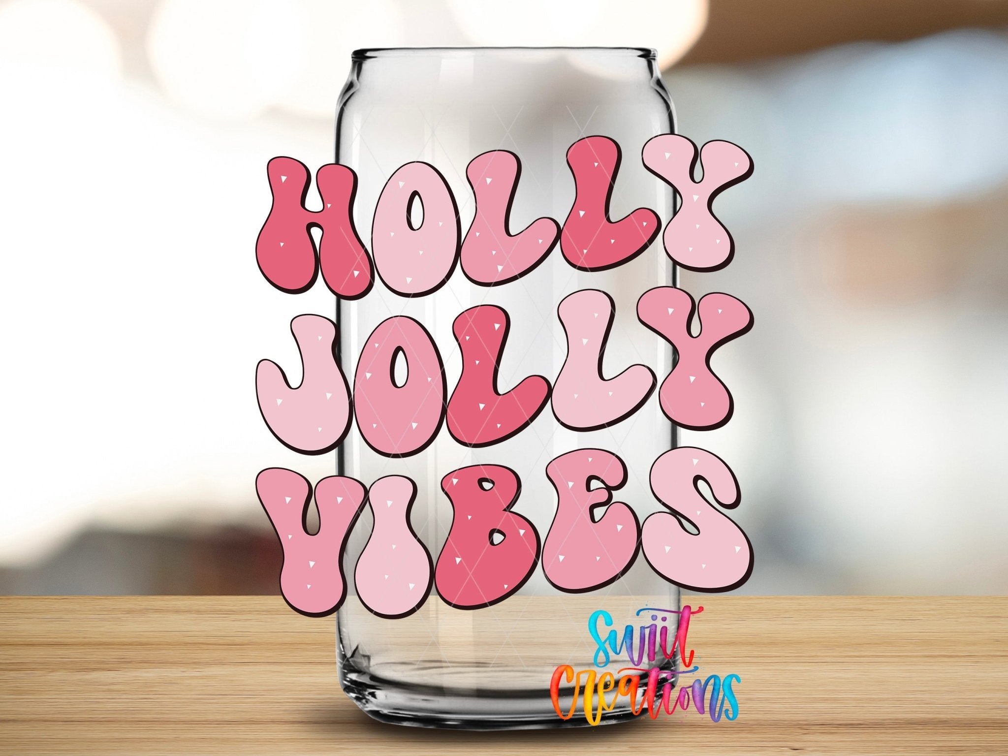 Swiit Creations UV DTF Holly Jolly Vibes Christmas transfer applied to a clear glass can
