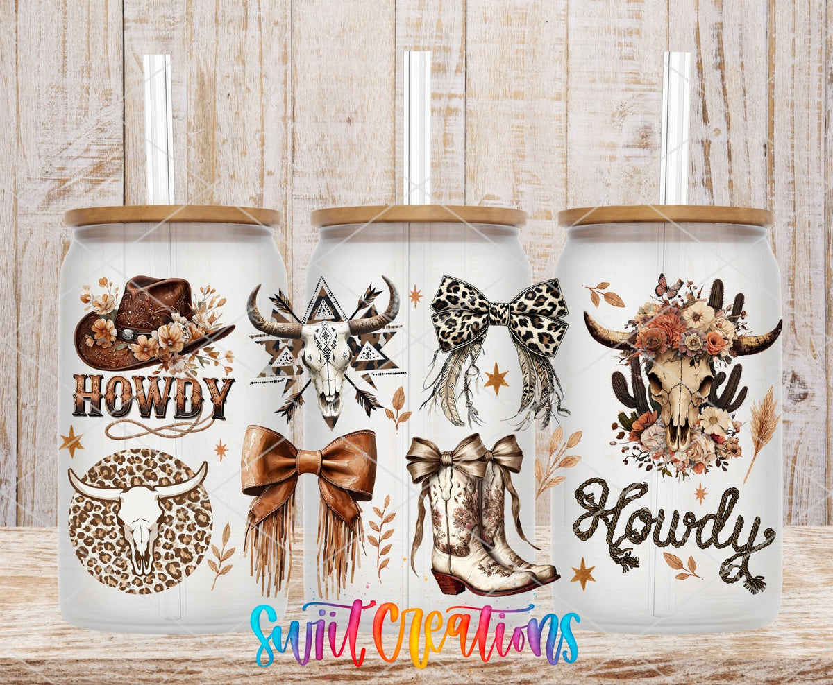 Howdy cowgirl boots, bows, and leopard skull UV DTF full wrap on three clear glass cans with bamboo lids