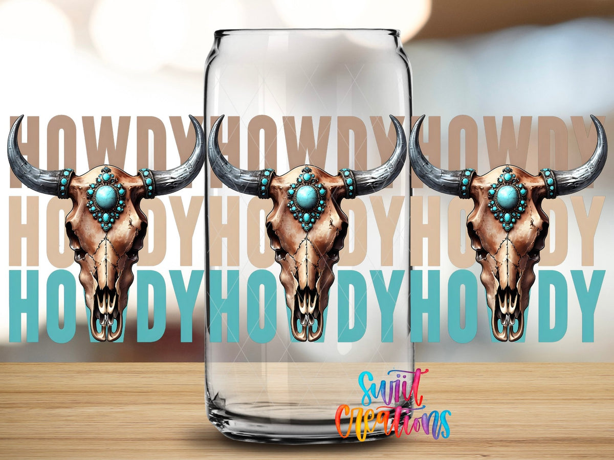 Close-up of the Howdy turquoise bull skulls UV DTF full wrap on a clear glass can