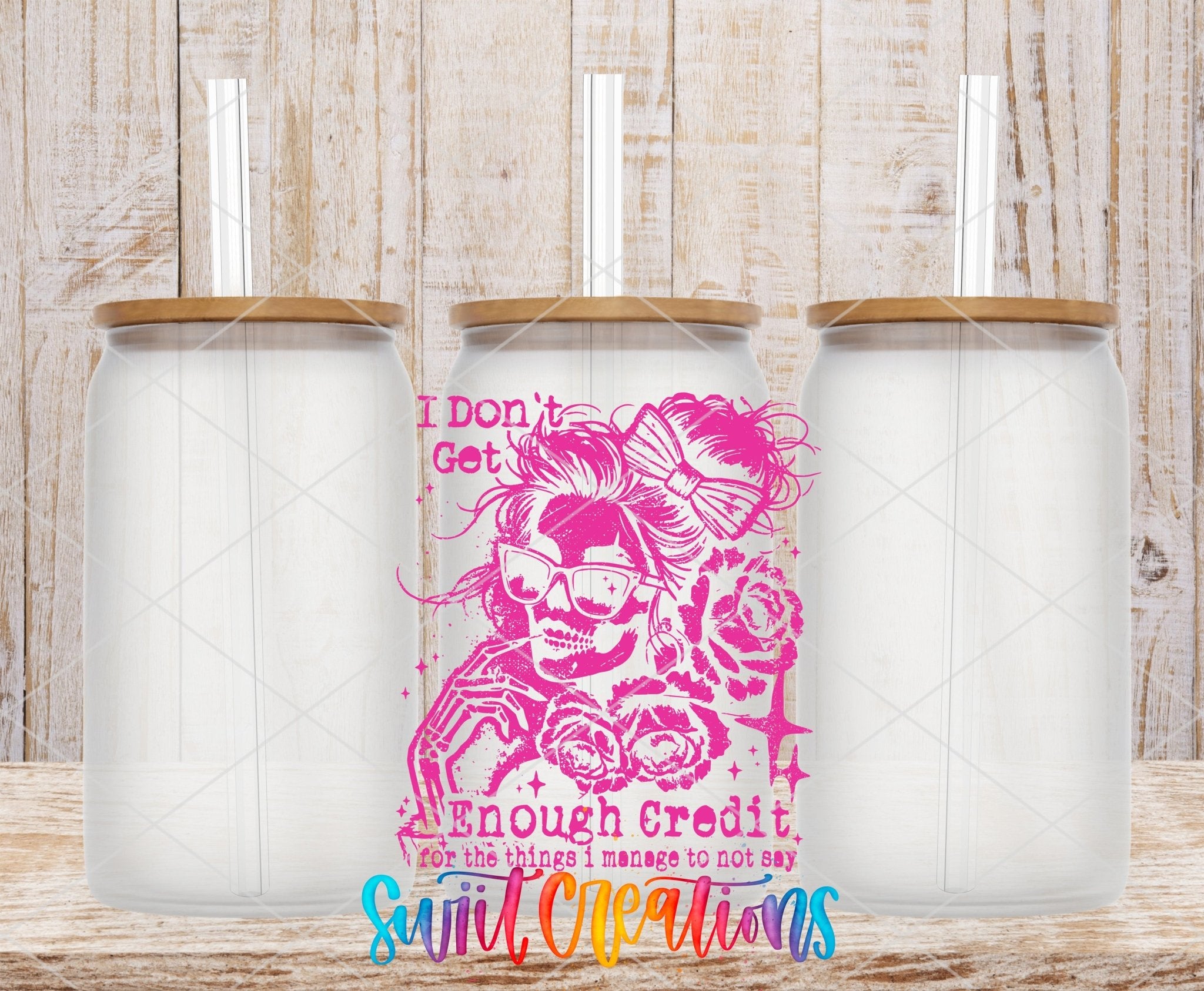 I Don’t Get Enough Credit UV DTF transfer applied to a clear glass can set from Swiit Creations