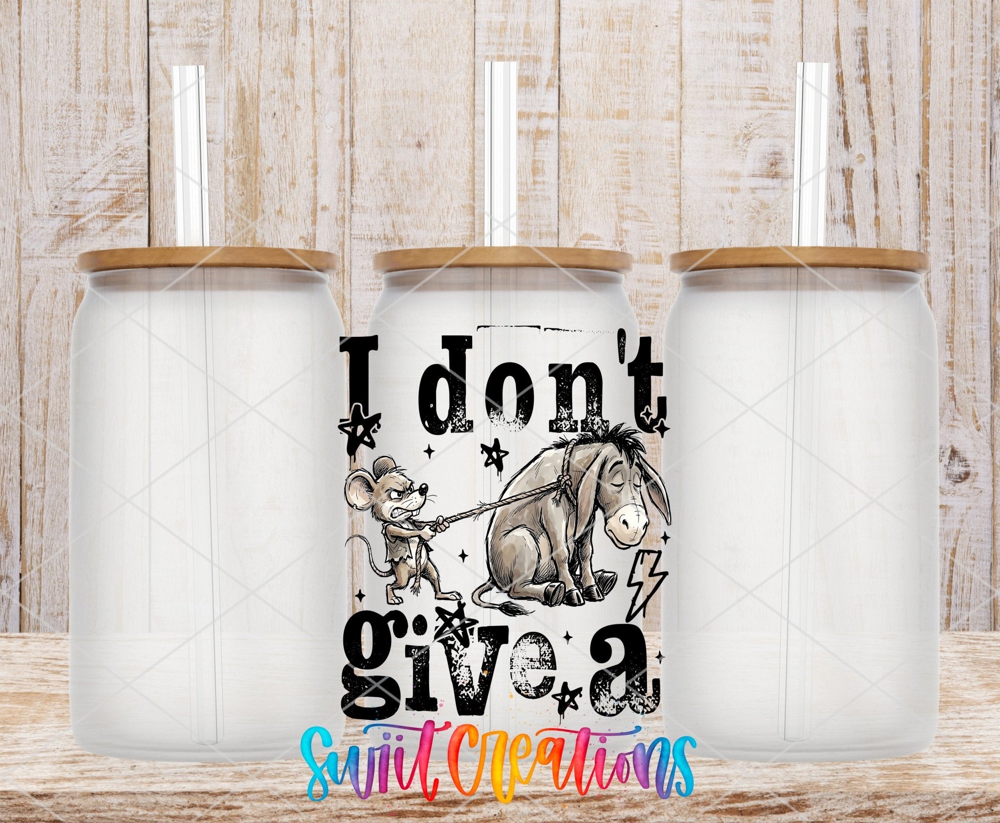 I Don’t Give A Rat’s Ass UV DTF transfer applied to a clear glass can set from Swiit Creations