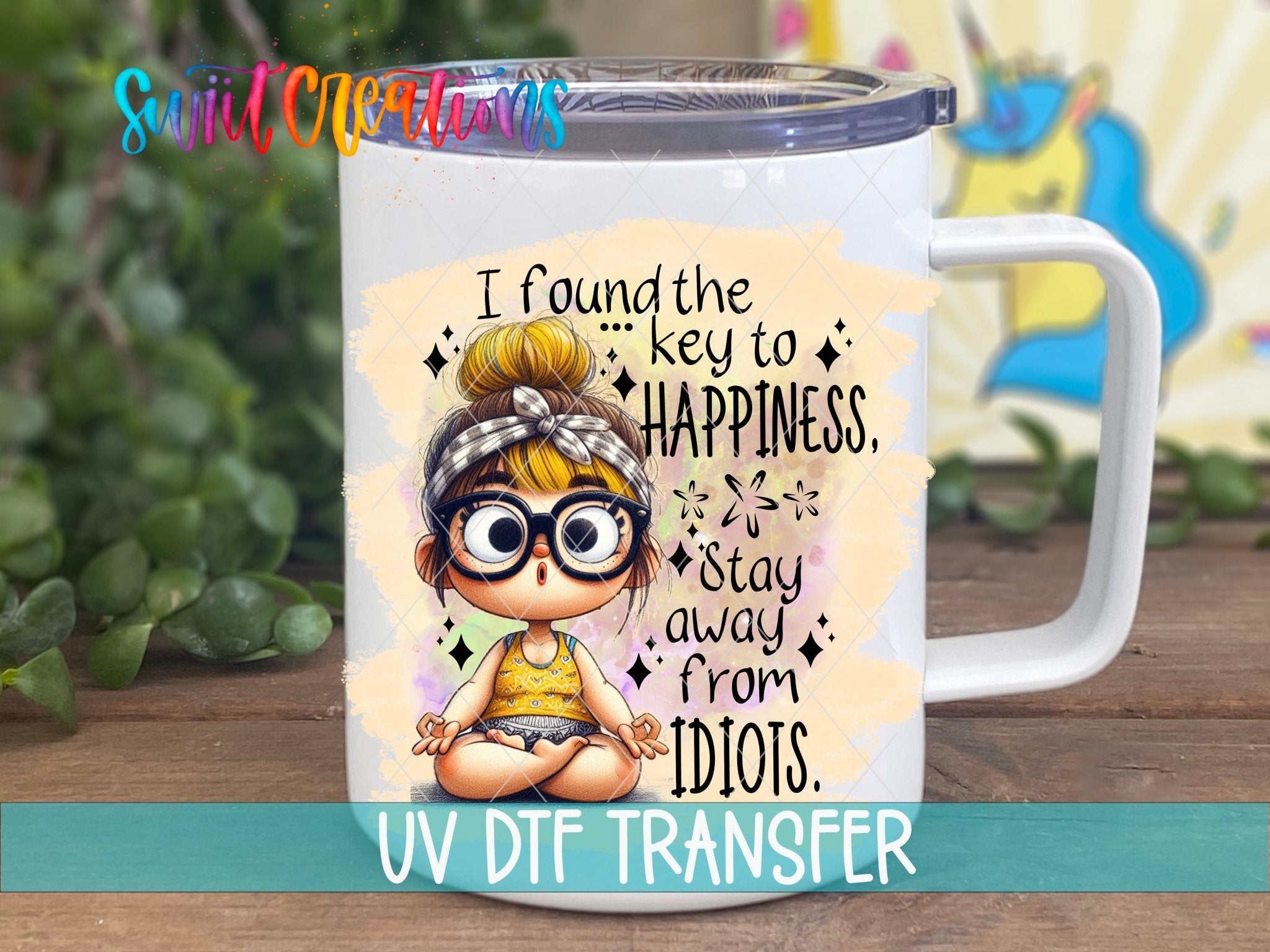 Swiit Creations UV DTF I Found the Secret to Happiness transfer displayed on a white coffee mug