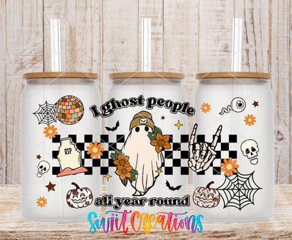 I Ghost People All Year Round UV DTF wrap on three clear glass cans with bamboo lids