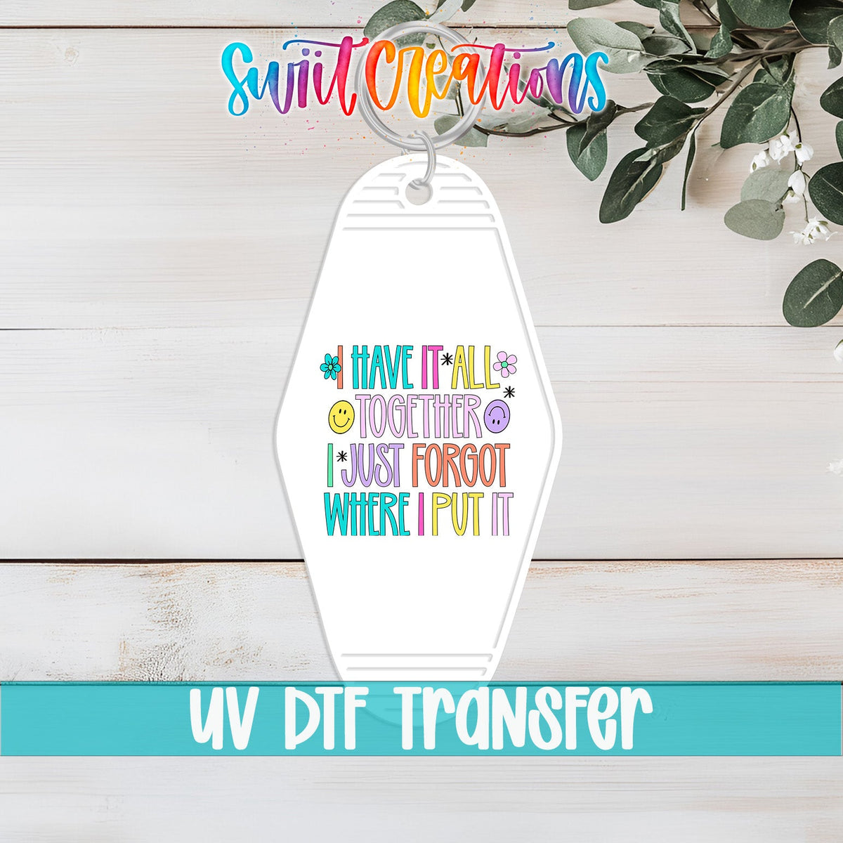 I Have It All Together I Just Forgot Where I Put It UV DTF transfer on a white motel keychain on a white wood table
