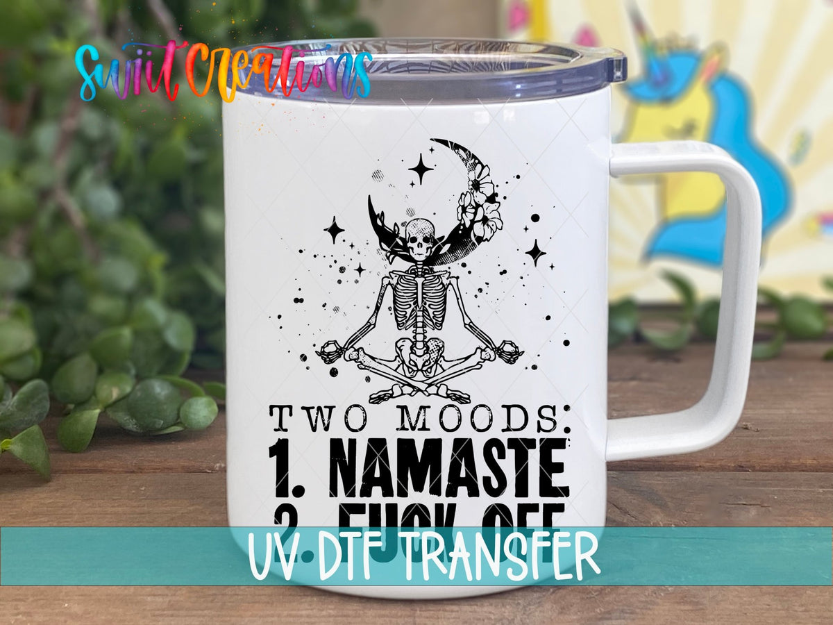 Two Moods Namaste and F*ck Off UV DTF transfer on a white stainless steel mug with a lid