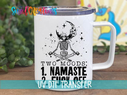 Two Moods Namaste and F*ck Off UV DTF transfer on a white stainless steel mug with a lid