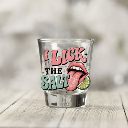 Close-up of the I Lick The Salt UV DTF transfer on a clear shot glass