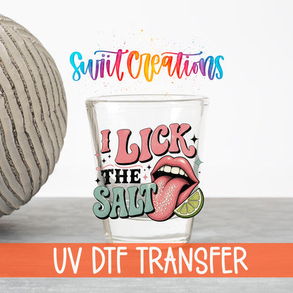 I Lick The Salt UV DTF transfer on a clear shot glass with the Swiit Creations logo and UV DTF Transfer banner