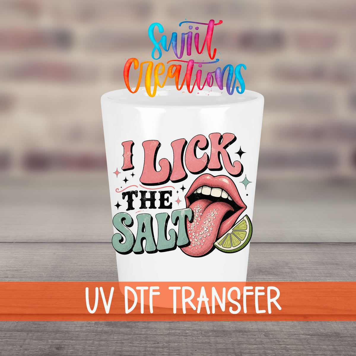 I Lick The Salt UV DTF transfer on a white shot glass in front of a brick wall