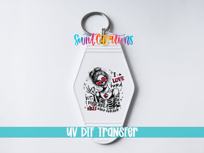 I Love Hard UV DTF transfer on a white motel keychain on a white background