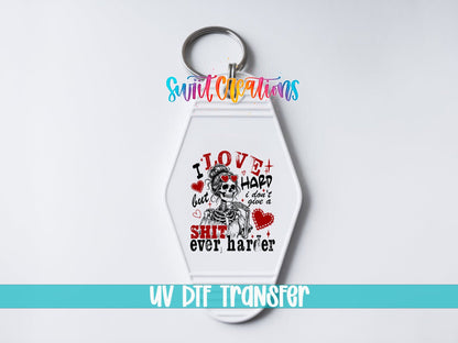 I Love Hard UV DTF transfer on a white motel keychain on a white background