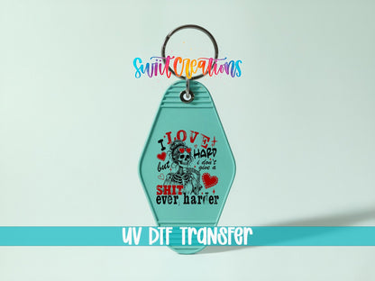 I Love Hard UV DTF transfer on a teal motel keychain on a mint background