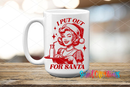 I Put Out for Santa UV DTF transfer on a white ceramic coffee mug