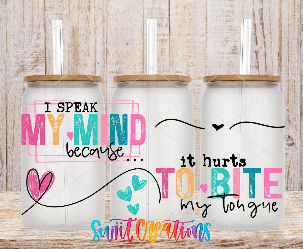 I Speak My Mind UV DTF wrap on three clear glass cans with bamboo lids